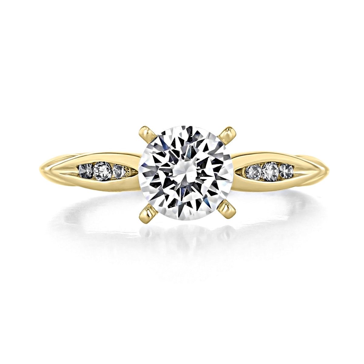 A round-cut diamond Quinn | Channel Set Engagement Ring by Gabriel & Co. in yellow gold with three small channel-set diamonds on each side of the band.