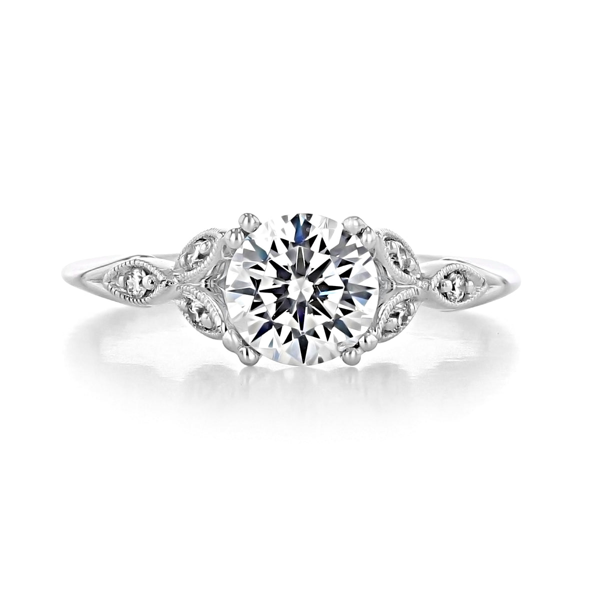 Celia Pavé Set Engagement Ring by Gabriel & Co. featuring a round brilliant-cut solitaire, a pavé-set band with marquise-shaped metal detailing, and delicate milgrain, capturing the essence of a vintage engagement ring.