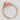 Abel halo engagement ring in rose gold featuring intricate scrollwork, engraved band details, and side-set diamonds.