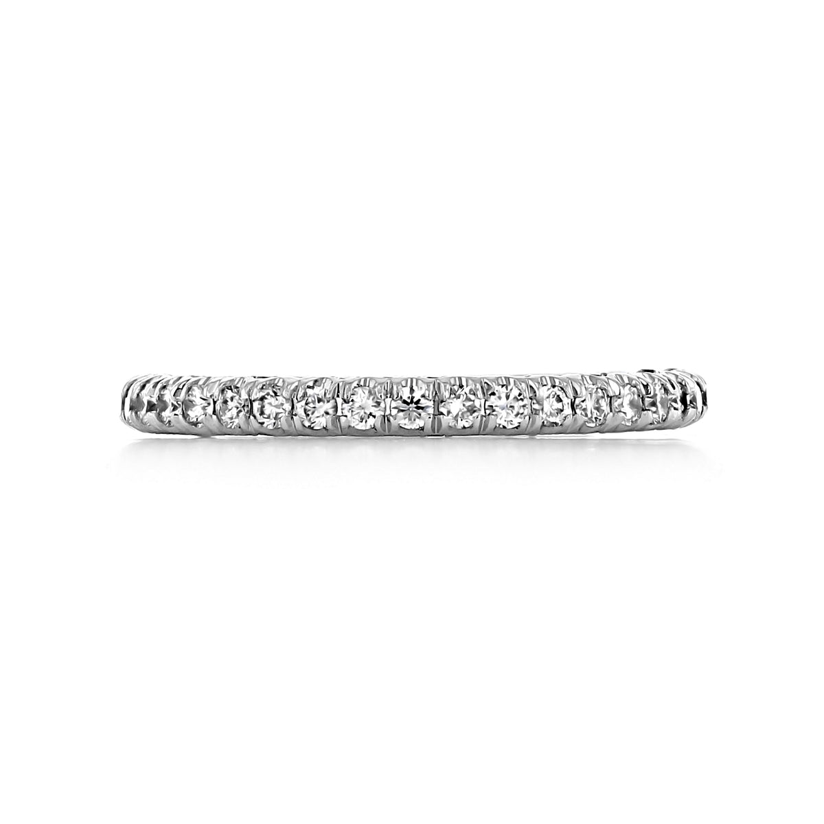 A white gold Petite Crescent | Wedding Band - HT2545B12W by Tacori, featuring a row of round-cut diamonds set halfway around the band.