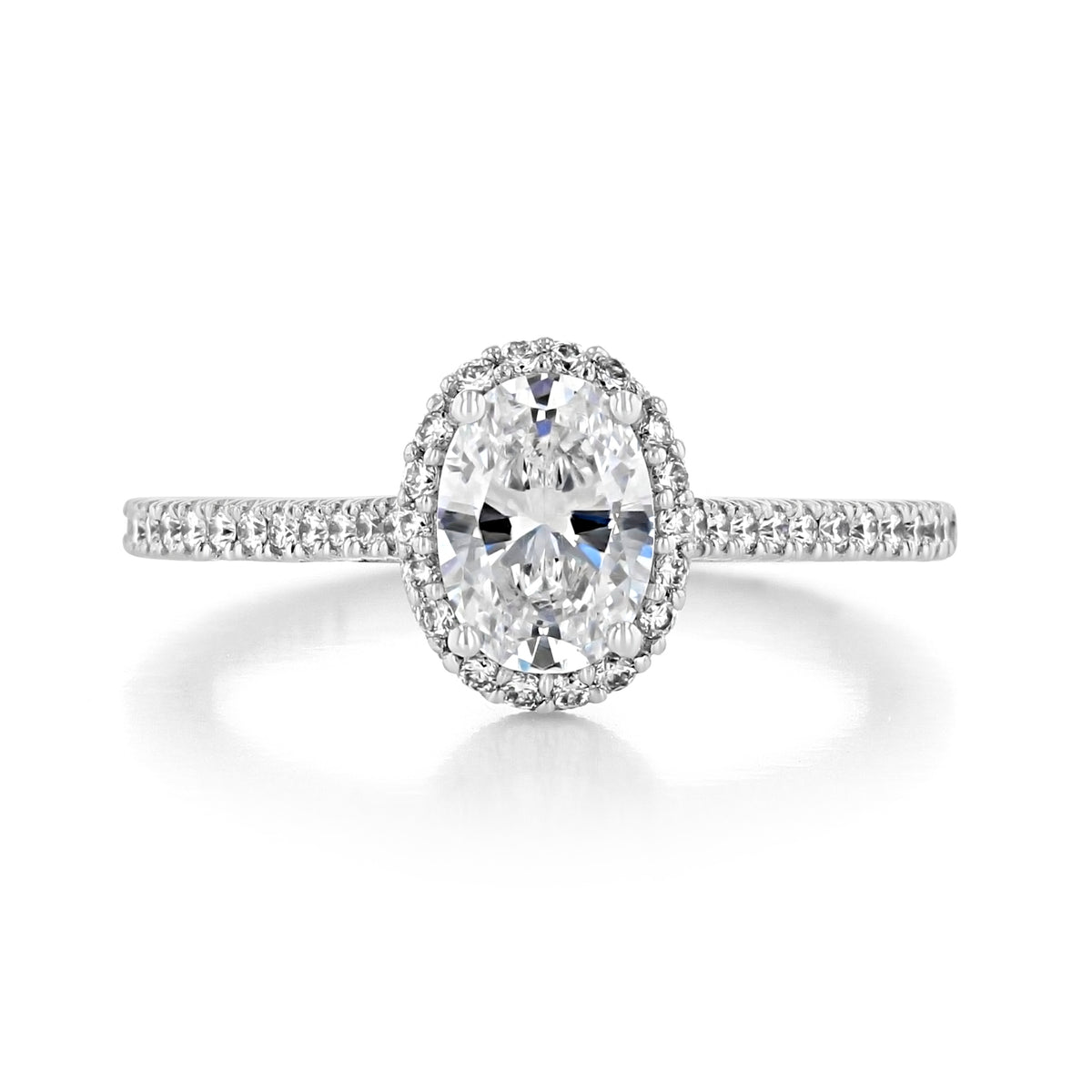 Petite Crescent | Oval Solitaire Engagement Ring - HT254715OV75X55 featuring an oval-cut diamond solitaire, a halo of diamonds, and a micro pavé diamond band.