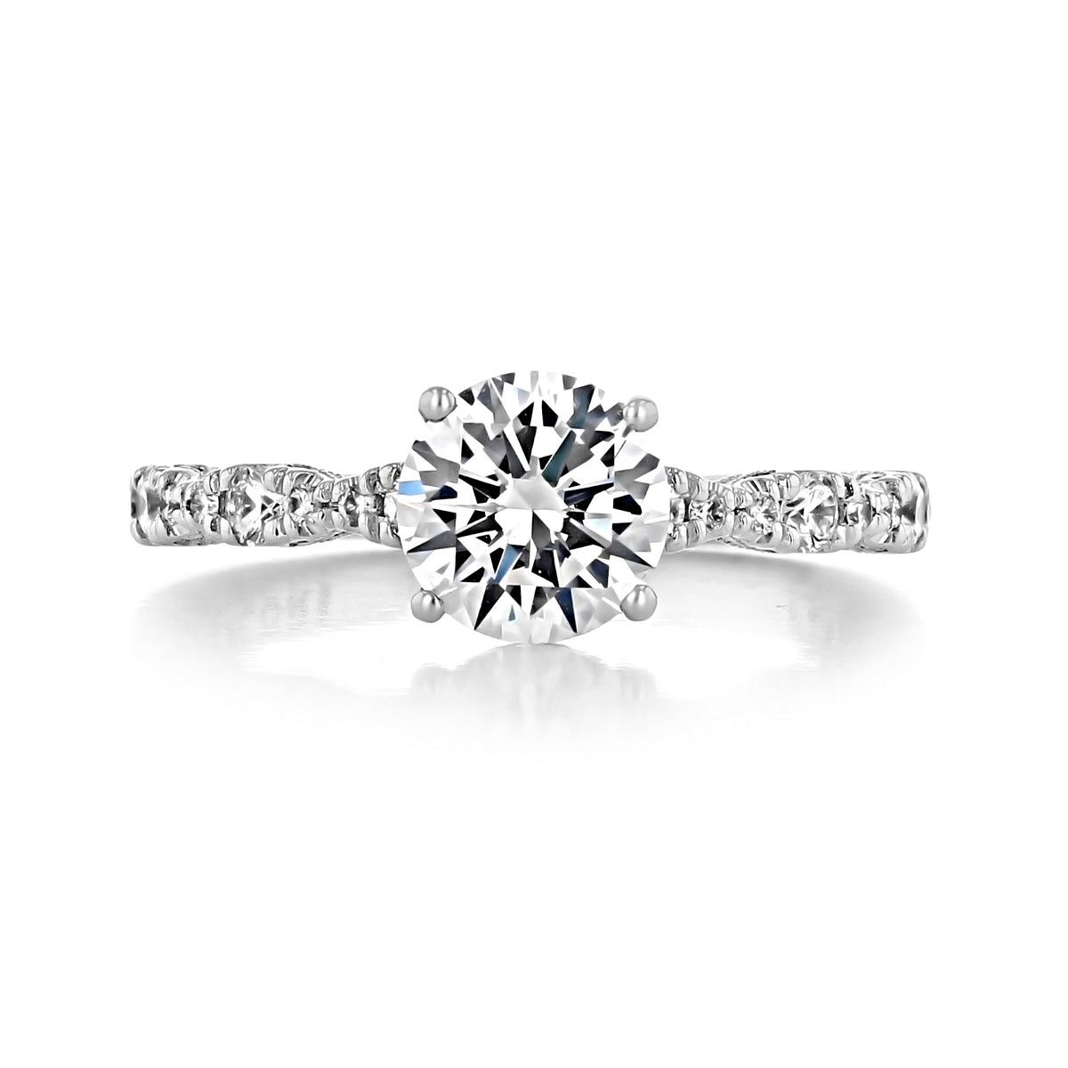 A Petite Crescent | Round Solitaire Engagement Ring - HT2559RD7 featuring a round-cut diamond solitaire set on a metallic band with decorative pavé-set stones along the shank.