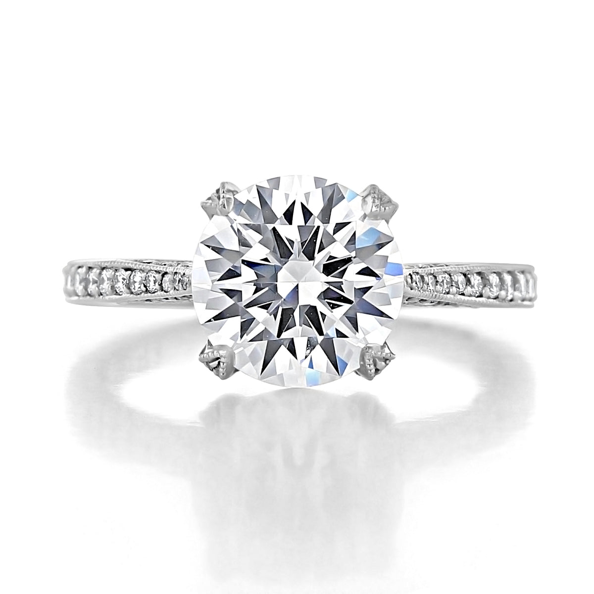 Tacori RoyalT | Round Pavé Engagement Ring - HT2627RD9 featuring a round-cut solitaire diamond, a pavé-set band, and intricate metal detailing.