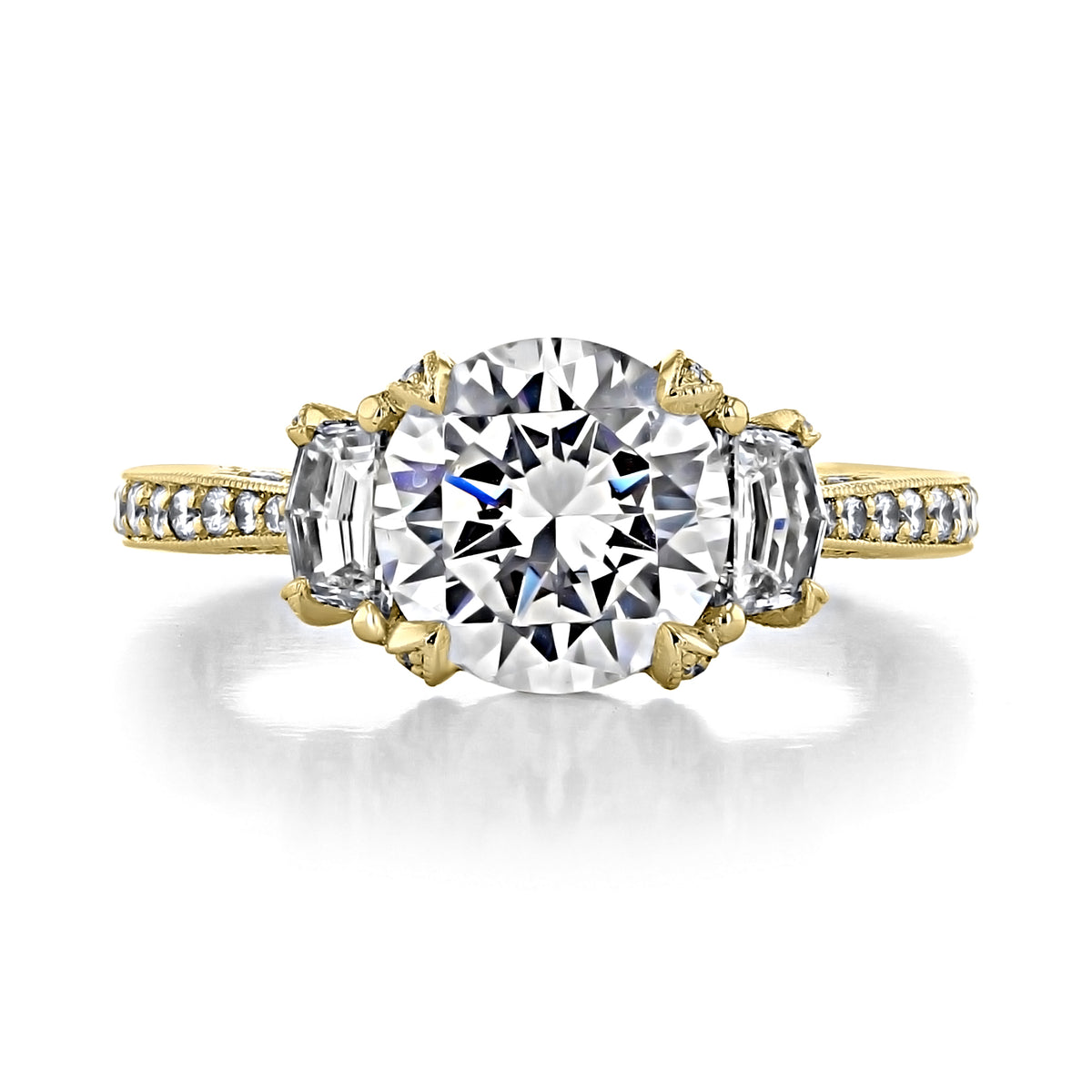 RoyalT | Round 3-Stone Engagement Ring - HT2655RD85Y in yellow gold, featuring a round center diamond flanked by two baguette diamonds on a band set with small accent stones.