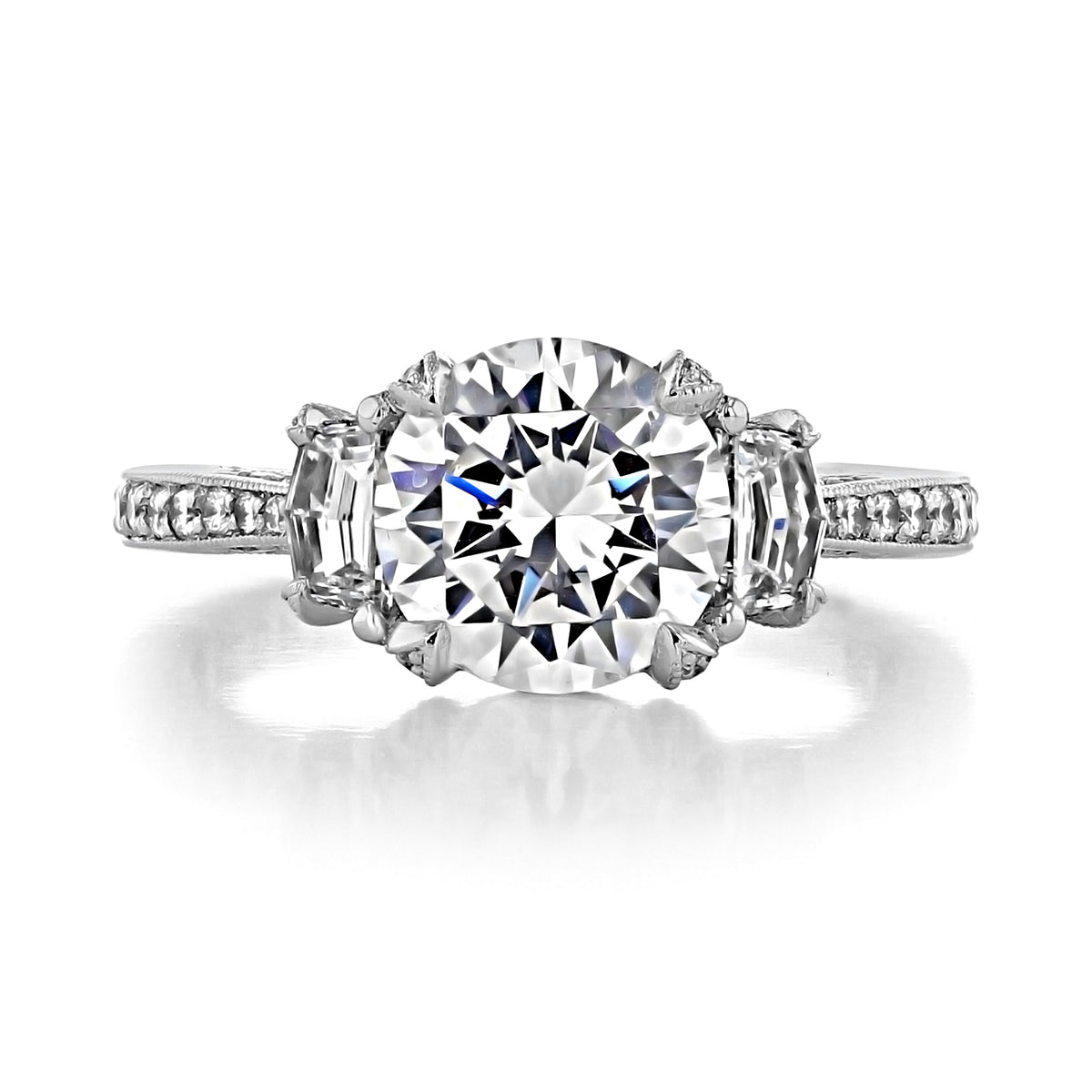 Tacori RoyalT | Round 3-Stone Engagement Ring - HT2655RD85 featuring a large round center diamond flanked by two tapered baguette side stones on a pavé-set band.
