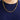 A 14K Yellow Gold 3.7MM Franco Solid Chain necklace worn around a person’s neck over a blue shirt.
