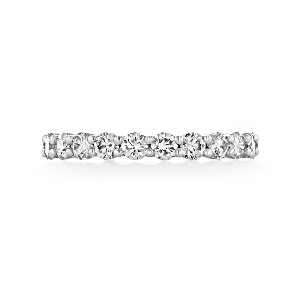 A Lucerra | Shared Prong Diamond Eternity Band featuring a continuous row of round diamonds set in a platinum shared prong wedding band.