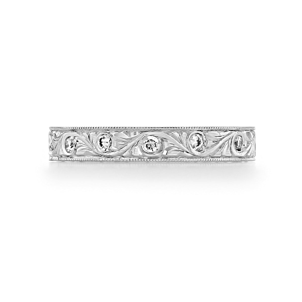 Florencia 3.2mm Engraved Pavé-Set Diamond Wedding Band by Icing On The Ring in 18k white gold featuring engraved scrollwork and a repeating pattern of pavé-set round diamonds.