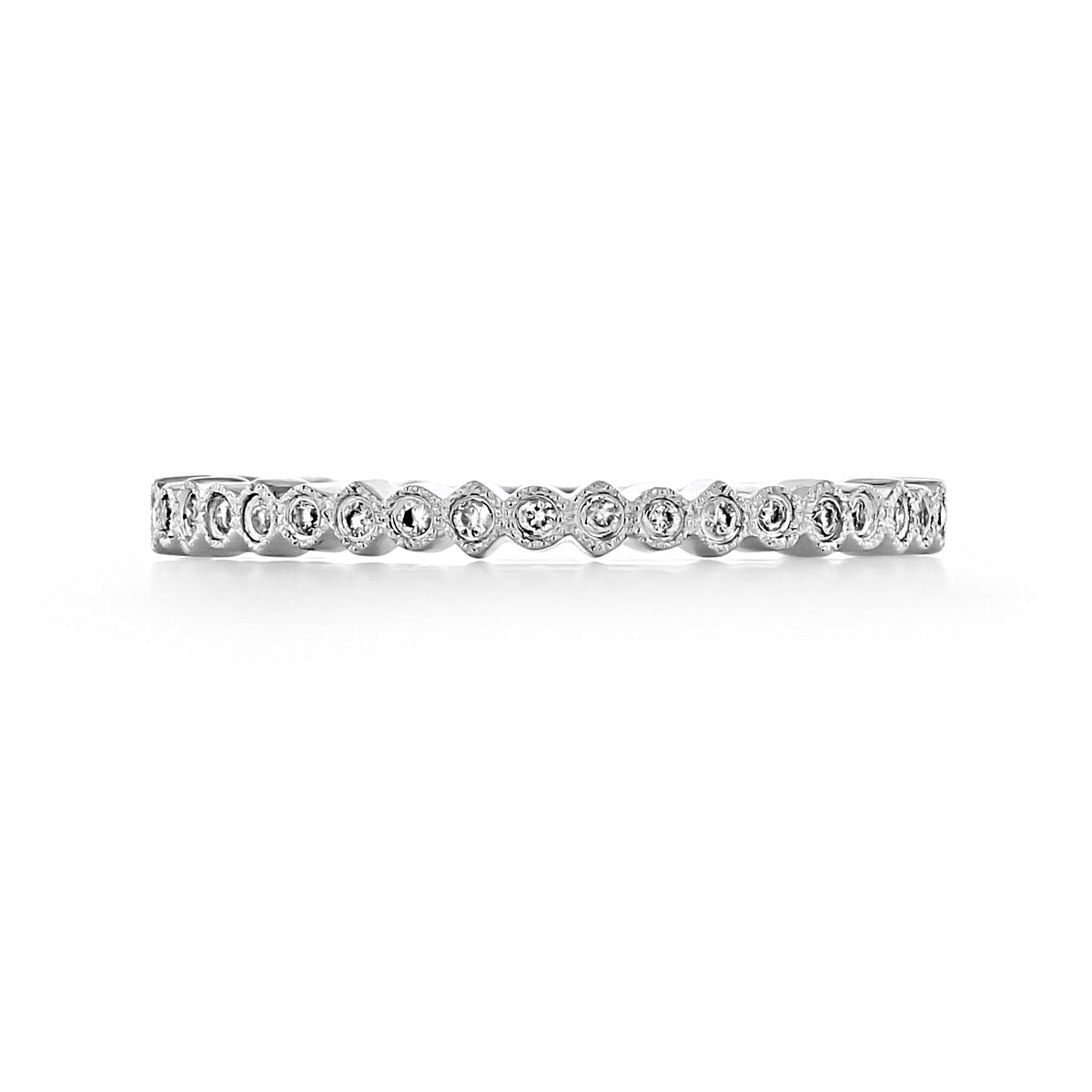 Terra | Round Bezel-Set Diamond Wedding Band in silver, featuring a row of round diamonds, each set in a scalloped milgrain bezel to create the perfect stackable band.