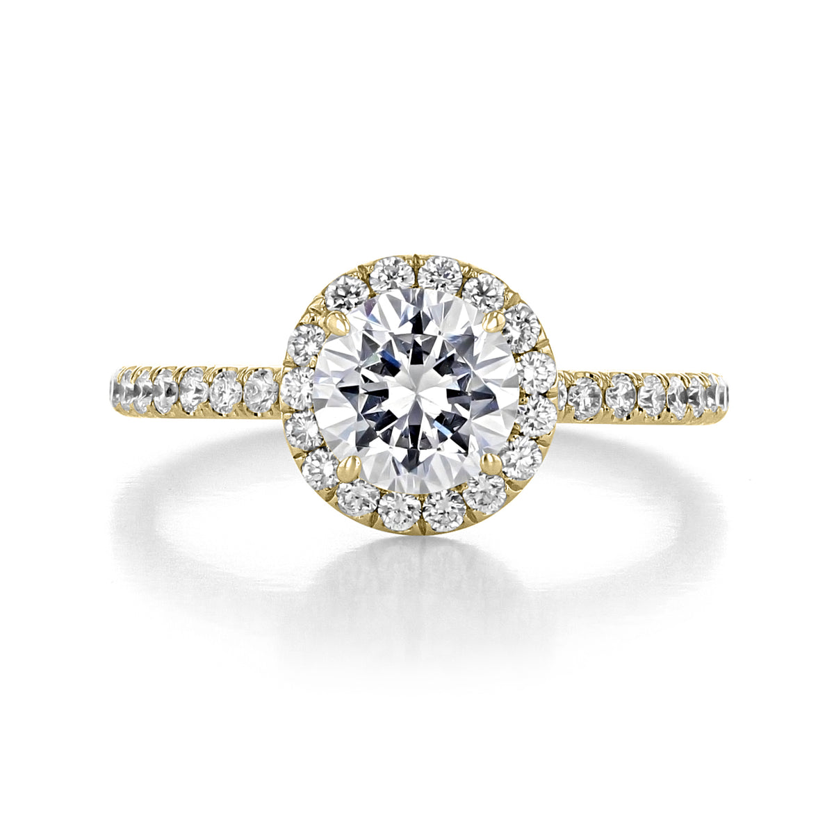 Danhov Per Lei Halo Engagement Ring - LE102 featuring a round center diamond surrounded by smaller pavé-set stones on the head and along the band.