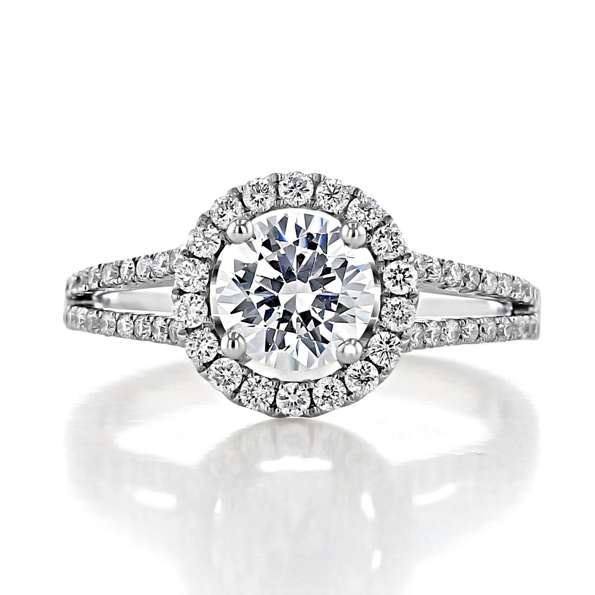 Habra Round Halo Engagement Ring featuring a round diamond with a halo setting and a split shank band, all with micro-prong pavé-set diamonds.