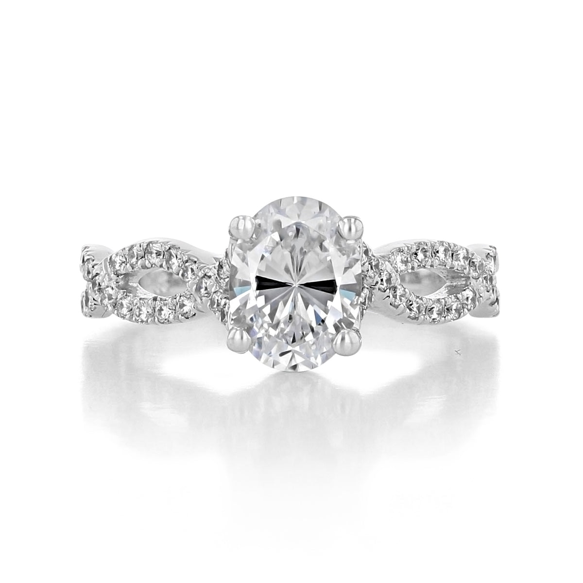 Calista | Oval Twisted Micro-Prong Engagement Ring featuring an oval-cut stone and a twisted, micro-prong diamond band.