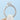 Tacori Coastal Crescent | Round Solitaire Engagement Ring - P100RD65 with decorative side carvings and small accent diamonds on the band, held up against a light blue background.