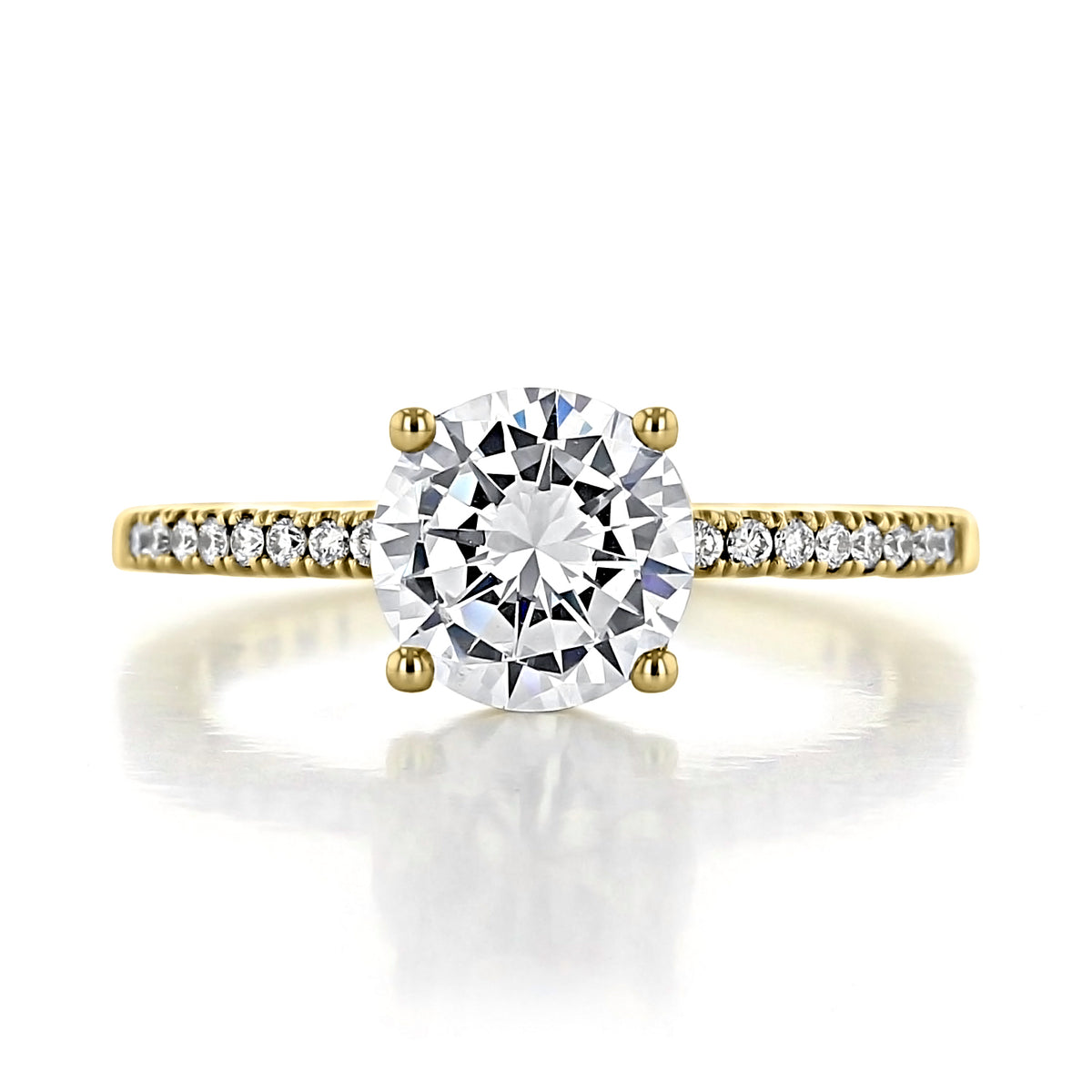 A Coastal Crescent | Round Solitaire Engagement Ring - P104RD75Y featuring a round solitaire diamond on a yellow gold band accented with smaller pavé diamonds.