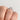 A Sculpted Crescent | Princess Solitaire Engagement Ring - 48PR55W worn on a finger, featuring a princess-cut solitaire diamond on a sculpted crescent band.
