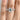 Emerald-cut solitaire Petite Crescent | Emerald Solitaire Engagement Ring - HT2545EC75X55 with a pavé diamond band worn on a finger.
