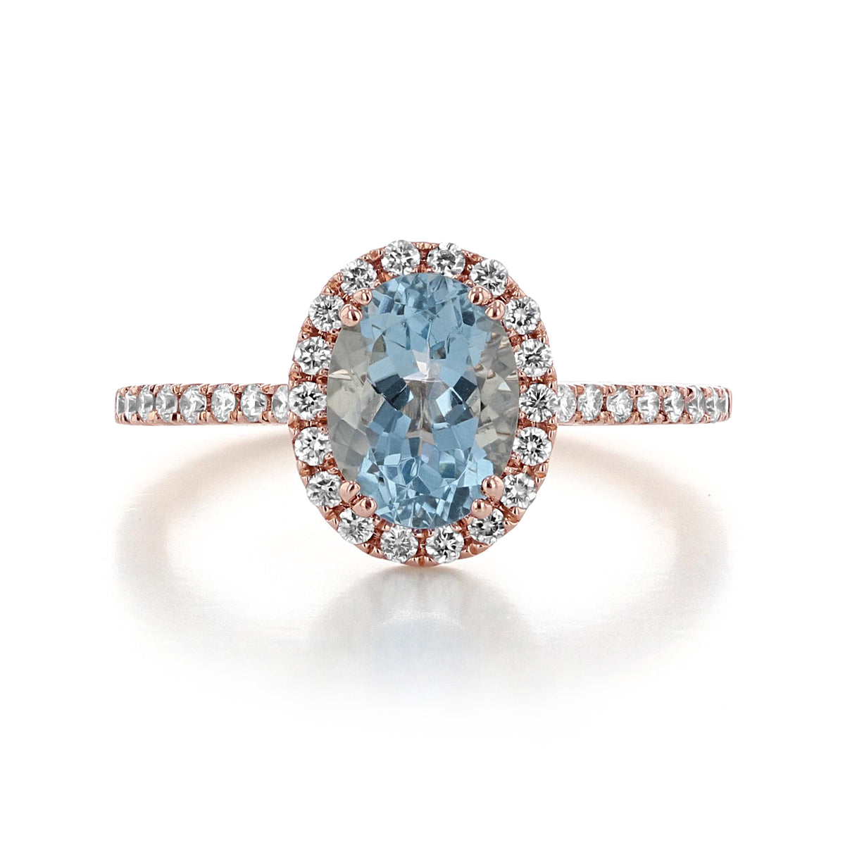 Makur Aquamarine Engagement Ring | R0861-4AQ featuring an oval aquamarine, a halo diamond design, and an accented band on a rose gold setting.