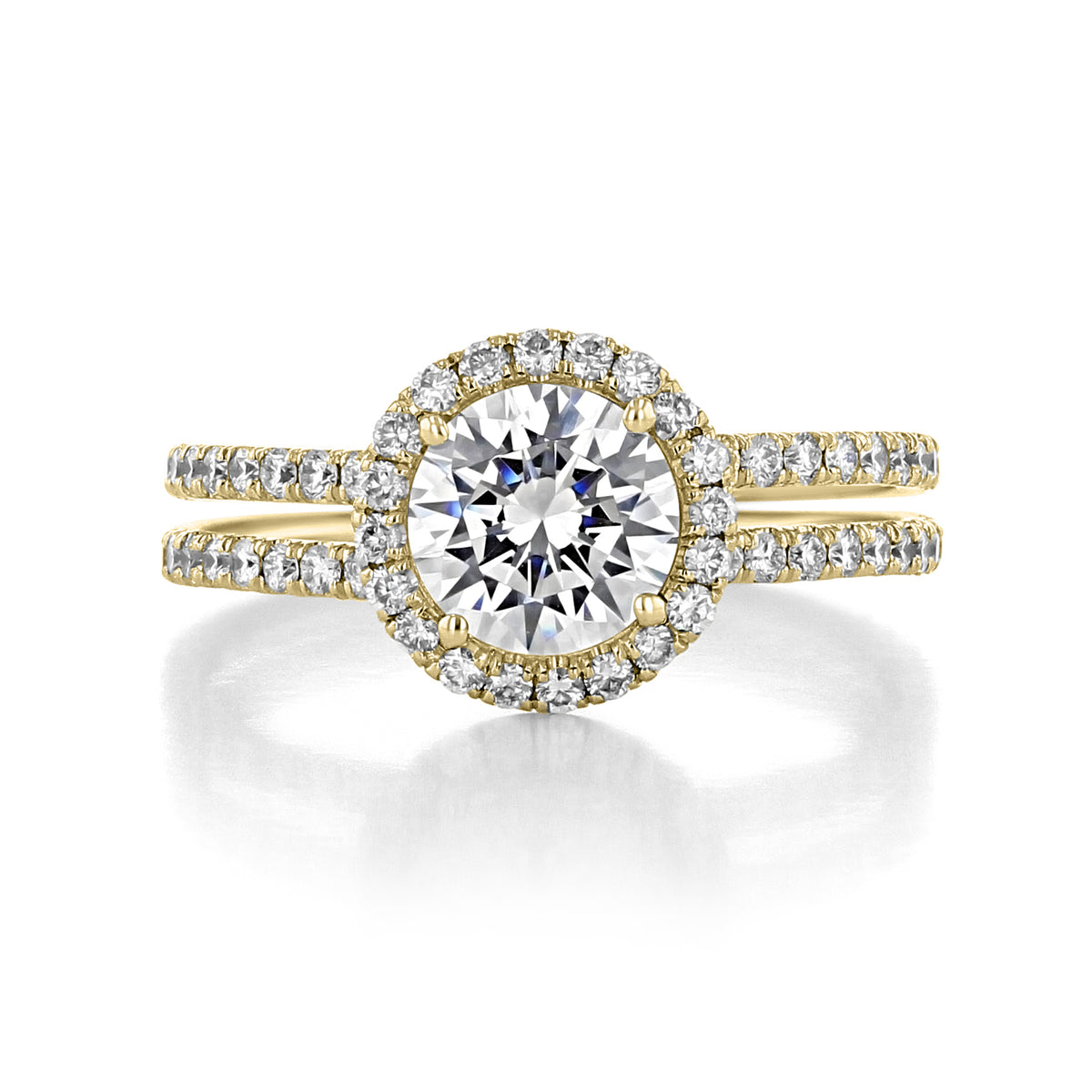 Danhov Solo Filo | Halo Engagement Ring - SE113 featuring a round center stone surrounded by a pavé diamond halo and a split shank band encrusted with diamonds.