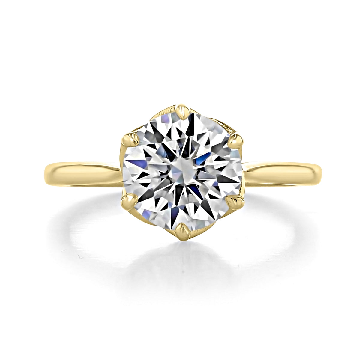 Delilah round solitaire engagement ring featuring a round diamond in a yellow gold tapered cathedral six-prong setting.