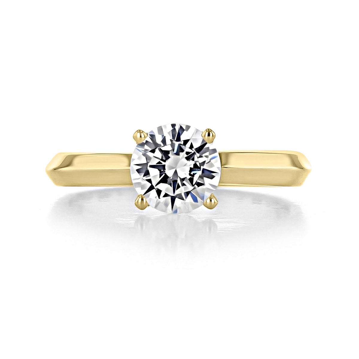 Elara | Round Solitaire Engagement Ring featuring a round diamond in a four-prong yellow gold setting.