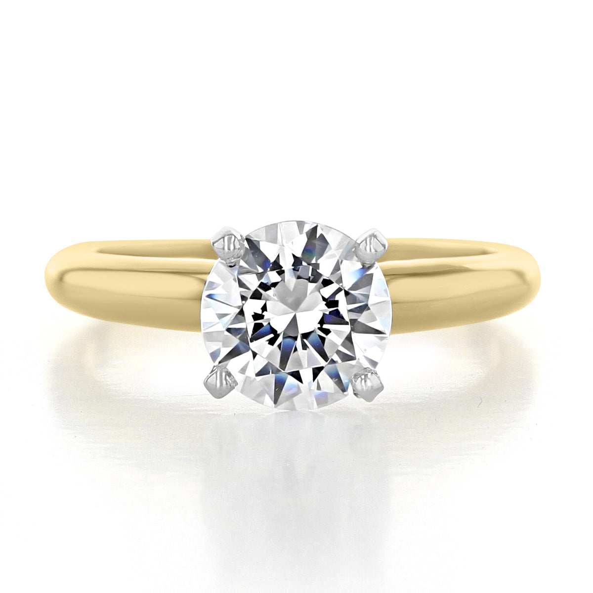 Icing On The Ring Solitaire Proposal Ring | SO38: A 14k yellow gold engagement ring with a round brilliant-cut diamond in a four-prong setting on a smooth band.