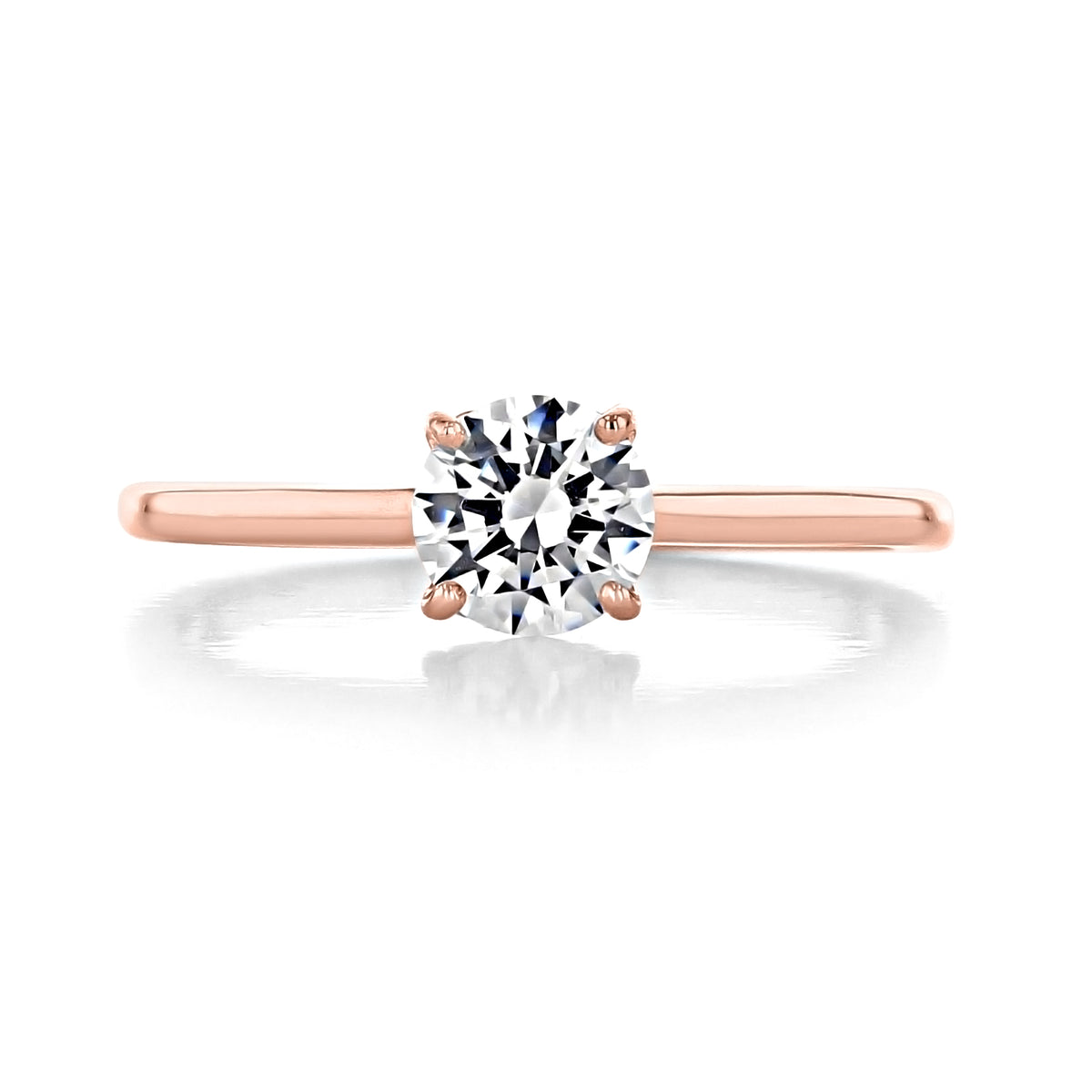 Laguna | Round Solitaire Engagement Ring featuring a round brilliant-cut diamond in a four-prong heart-shaped basket on a rose gold band.