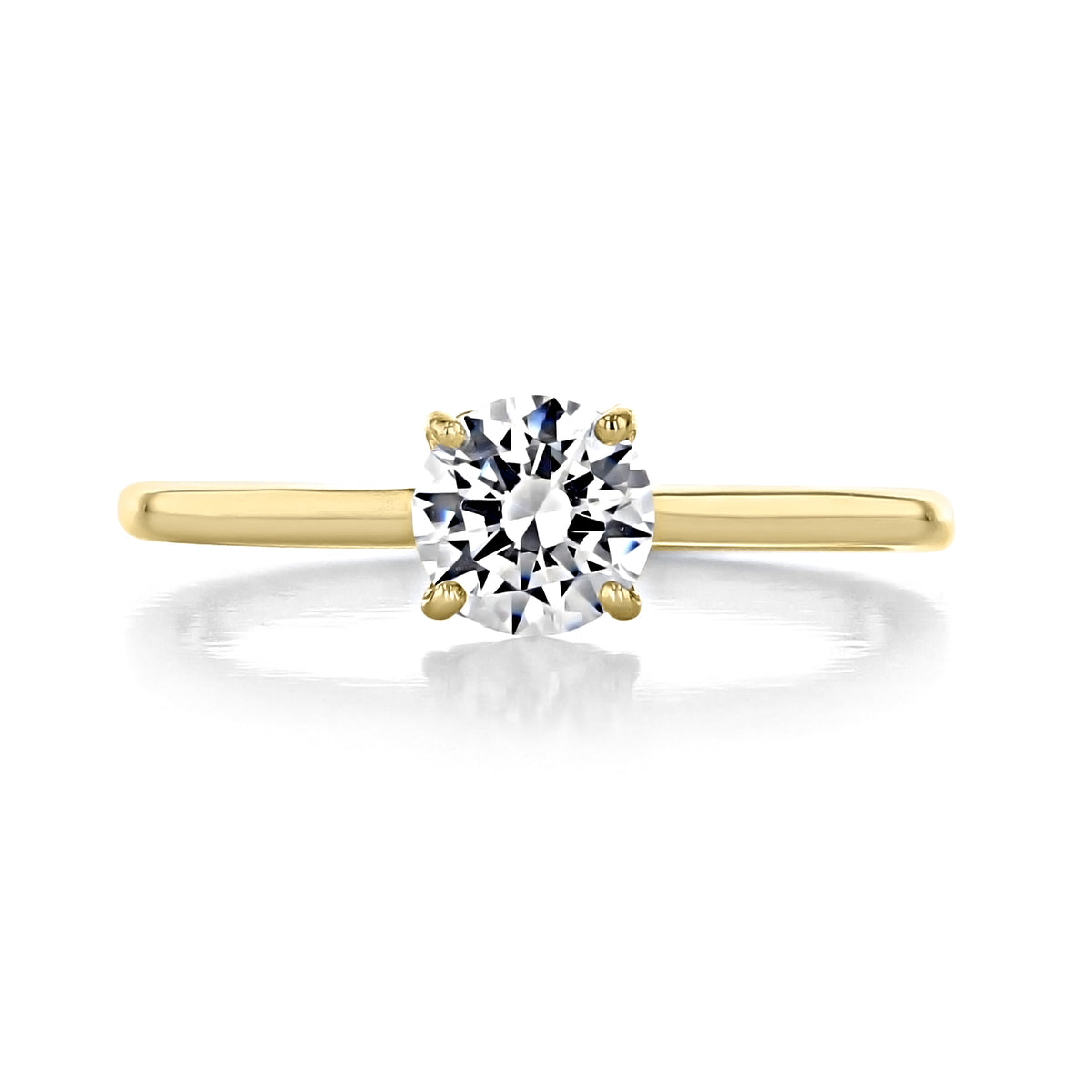 Laguna | Round Solitaire Engagement Ring by Icing On The Ring featuring a round solitaire diamond set in a heart-shaped basket on a yellow gold band.