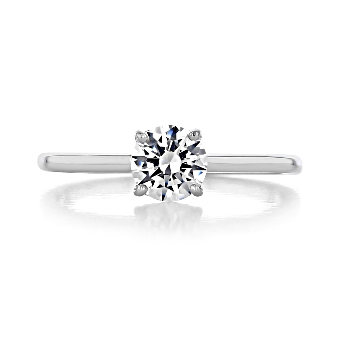 Laguna | Round Solitaire Engagement Ring featuring a stone in a four-prong, heart-shaped basket setting on a smooth white gold band.