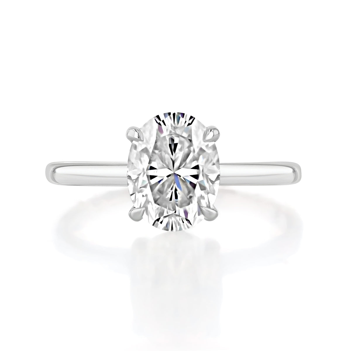 Laurel Oval Solitaire Engagement Ring featuring an oval-cut solitaire diamond on a plain 14K platinum band.