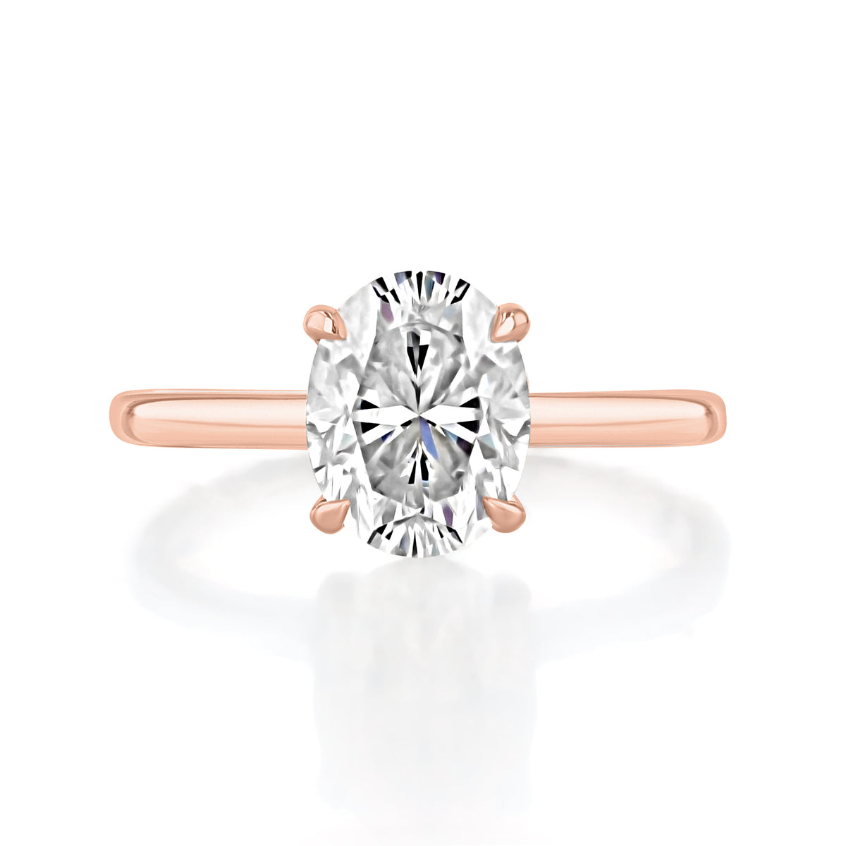 Laurel | Oval Solitaire Engagement Ring featuring an oval solitaire diamond set on a 14K rose gold band.