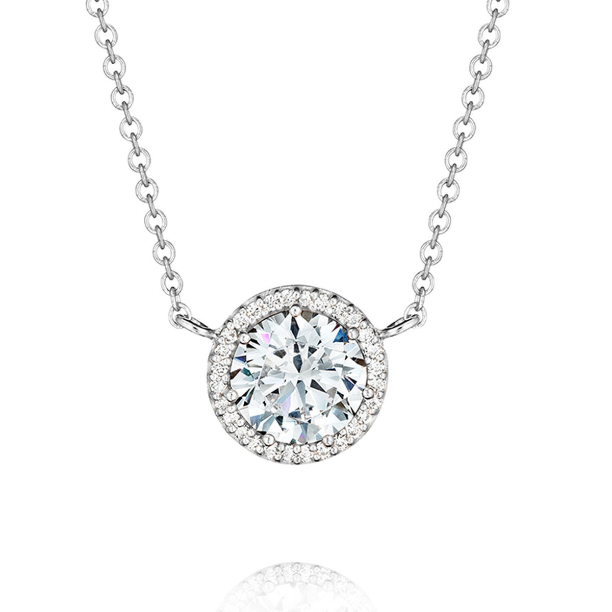 A Tacori Dantela Fashion Necklace FP6706 featuring a round pendant with a large central stone surrounded by a halo of pavé stones on an 18k white gold chain.