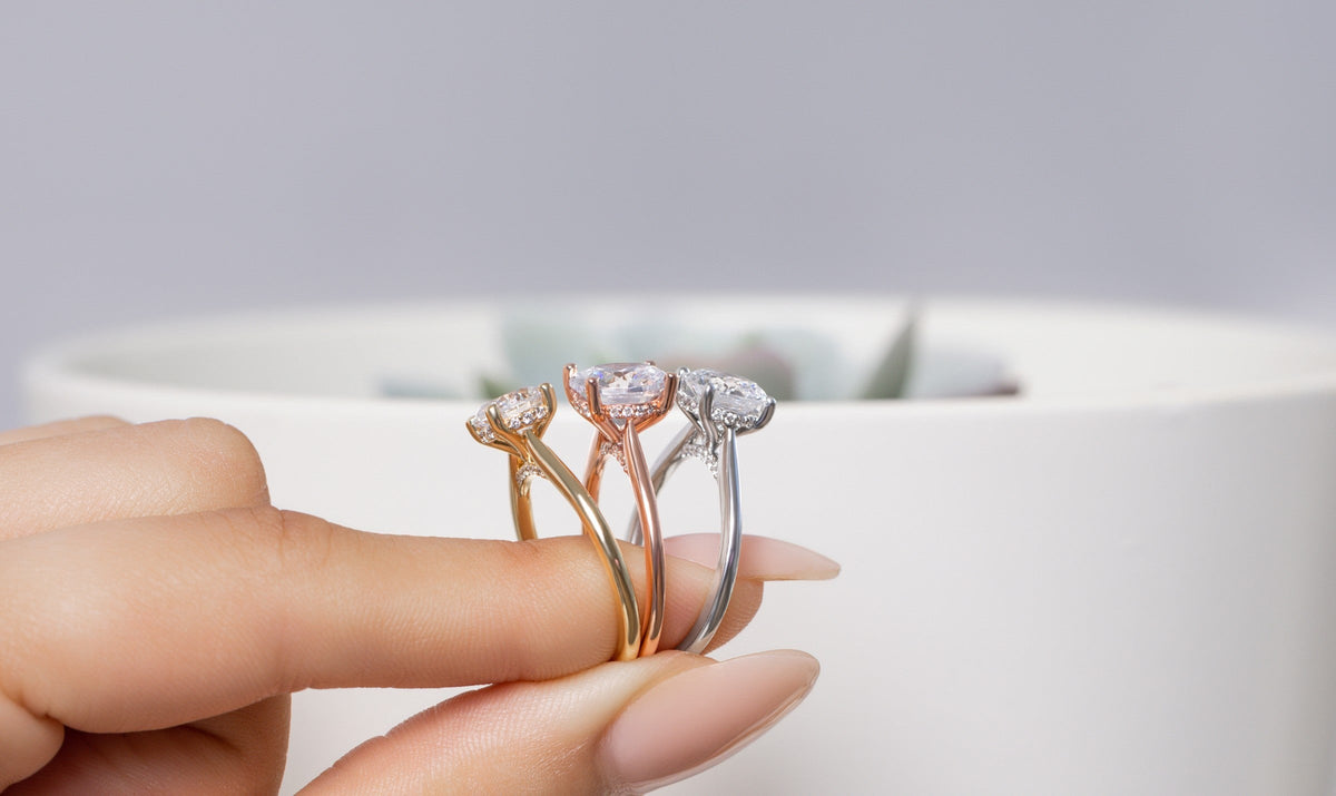 Yellow, rose and white gold engagement rings held together