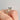 An Icing On The Ring Solitaire Proposal Ring | SO38, featuring a 14k yellow gold band with a round solitaire diamond, worn on a finger.
