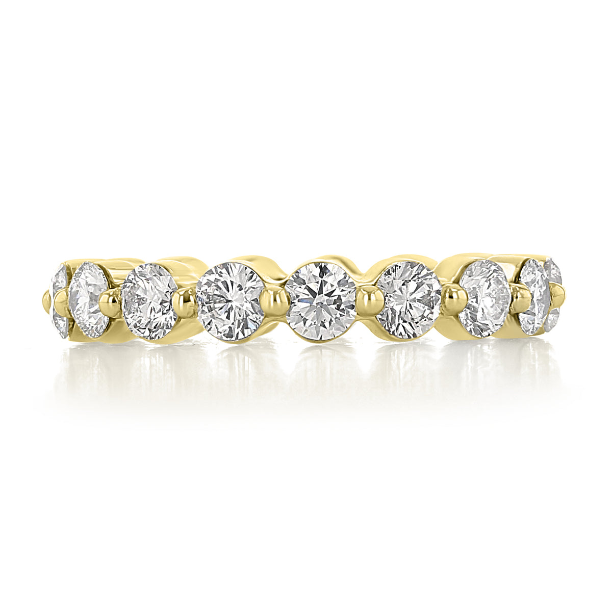 Maribel single prong diamond wedding band in 14k yellow gold featuring a row of round lab-grown diamonds held by single prongs.