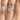 A Tacori Petite Crescent | Round Solitaire Engagement Ring - HT2559RD7W with a round solitaire diamond and pavé-set diamonds on the band, worn on a finger.