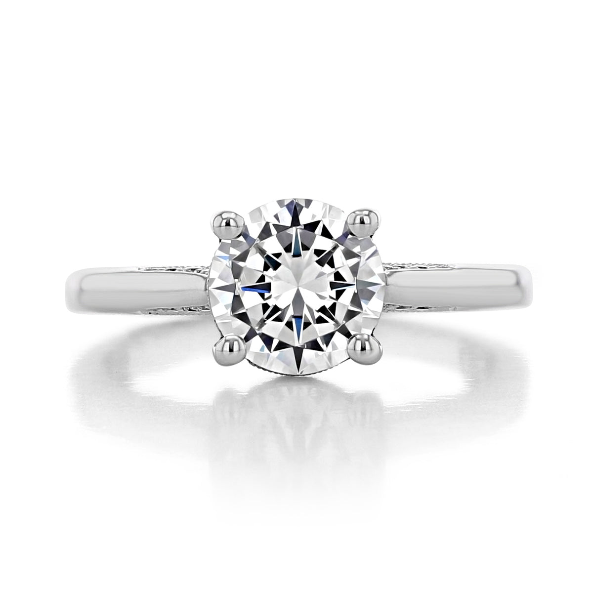 A Dantela | Round Solitaire Engagement Ring - 2638RD6 featuring a round-cut solitaire diamond on a vintage-inspired platinum band with intricate side detailing.