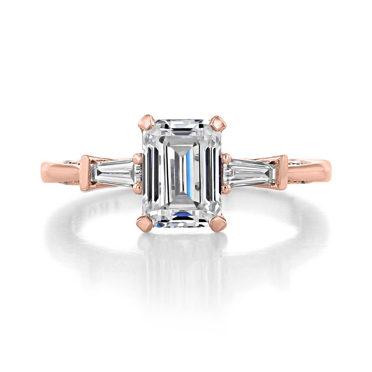 A Simply Tacori | Emerald 3-Stone Engagement Ring - 2669EC75X55PK featuring a rectangular emerald-cut center diamond flanked by two tapered baguette diamonds set on a rose gold band.