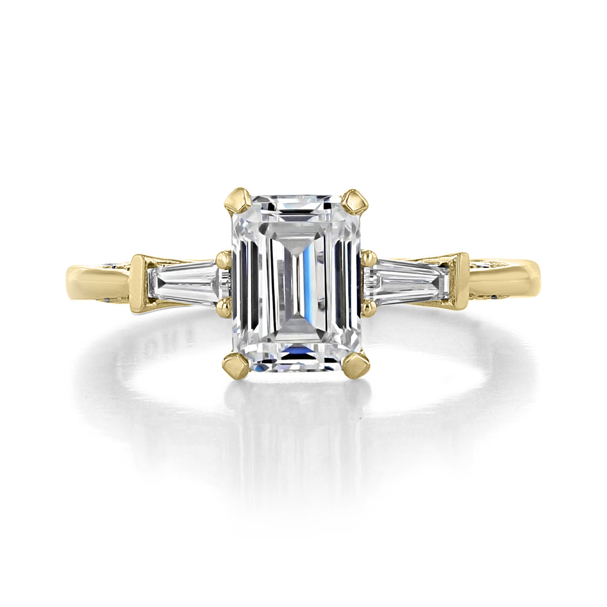 Simply Tacori Emerald 3-Stone Engagement Ring - 2669EC75X55Y featuring a large emerald-cut center diamond flanked by two baguette-cut side stones on a yellow gold band.