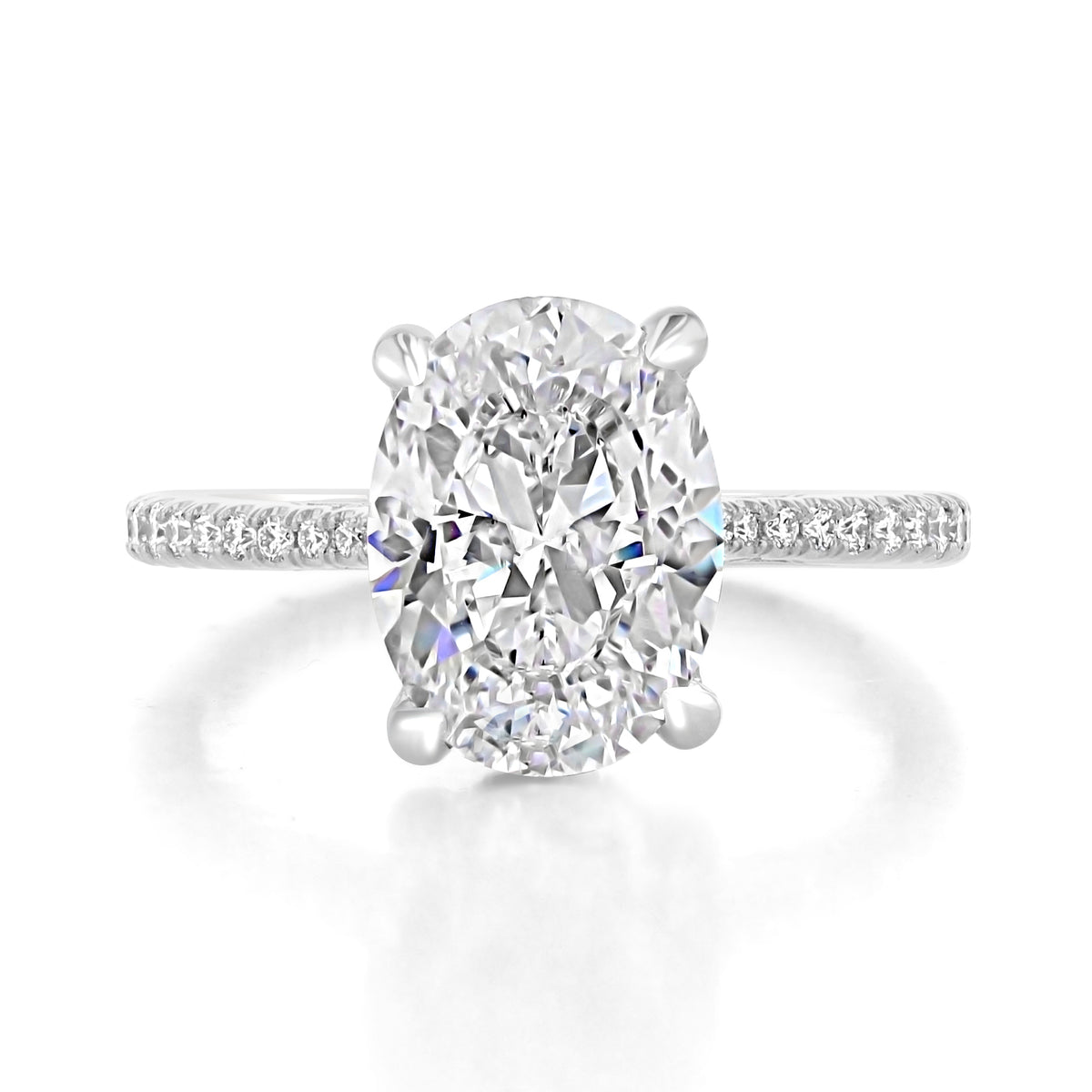 Simply Tacori | Oval Solitaire Engagement Ring - 2671OV115X85 featuring an oval-cut solitaire on a diamond-embellished pavé band against a white background.