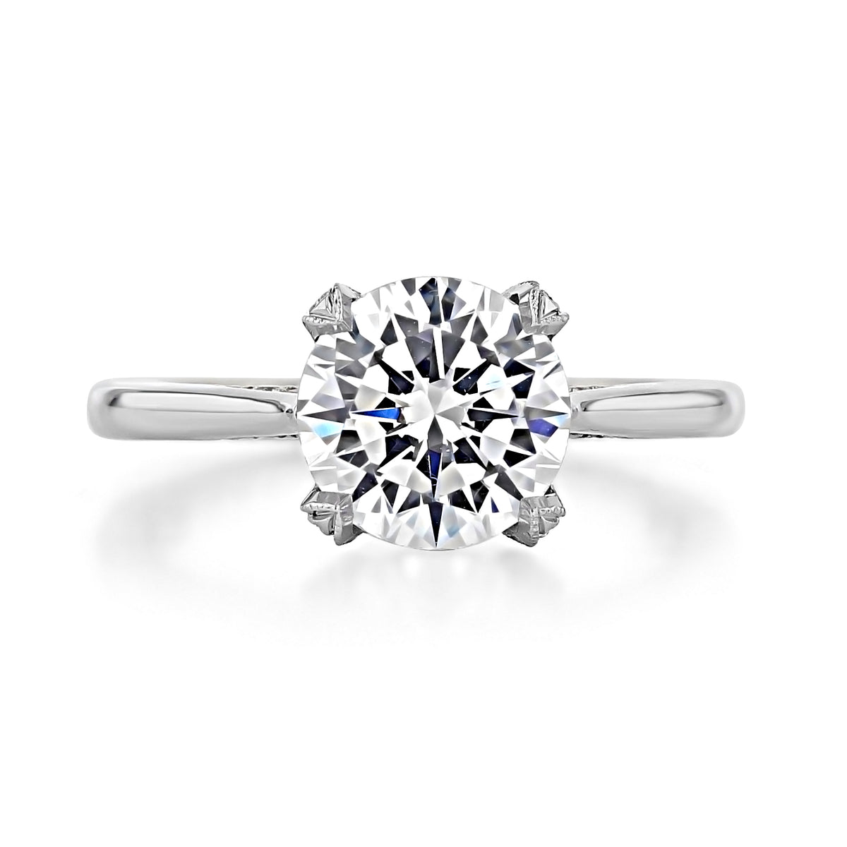 Simply Tacori round solitaire engagement ring 2678RD85W featuring a high-polish white gold band and a four-prong setting.