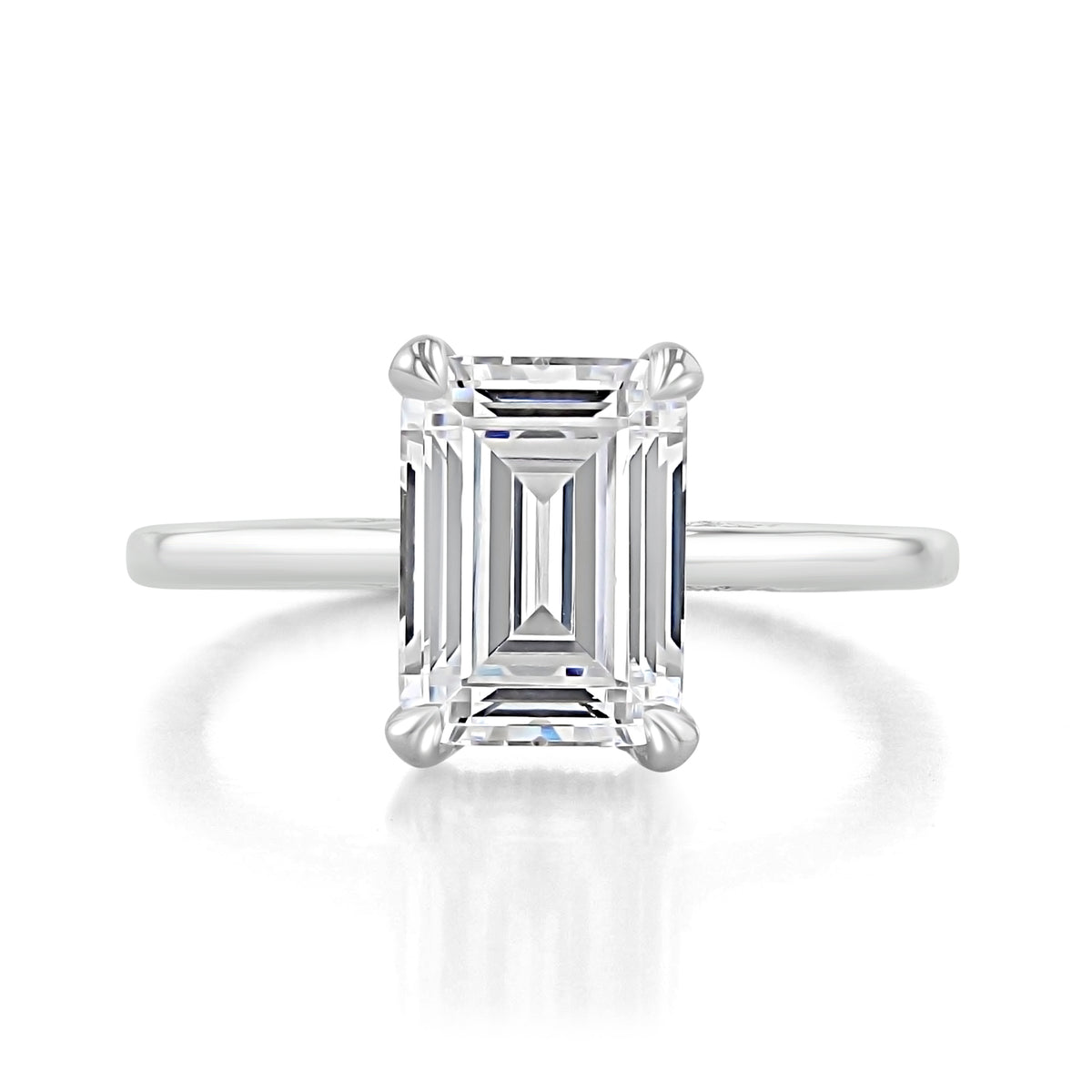 Simply Tacori Emerald Solitaire Engagement Ring 268815EC95X7W featuring an emerald-cut diamond in a four-prong setting with a diamond-accented basket and a plain metal band.