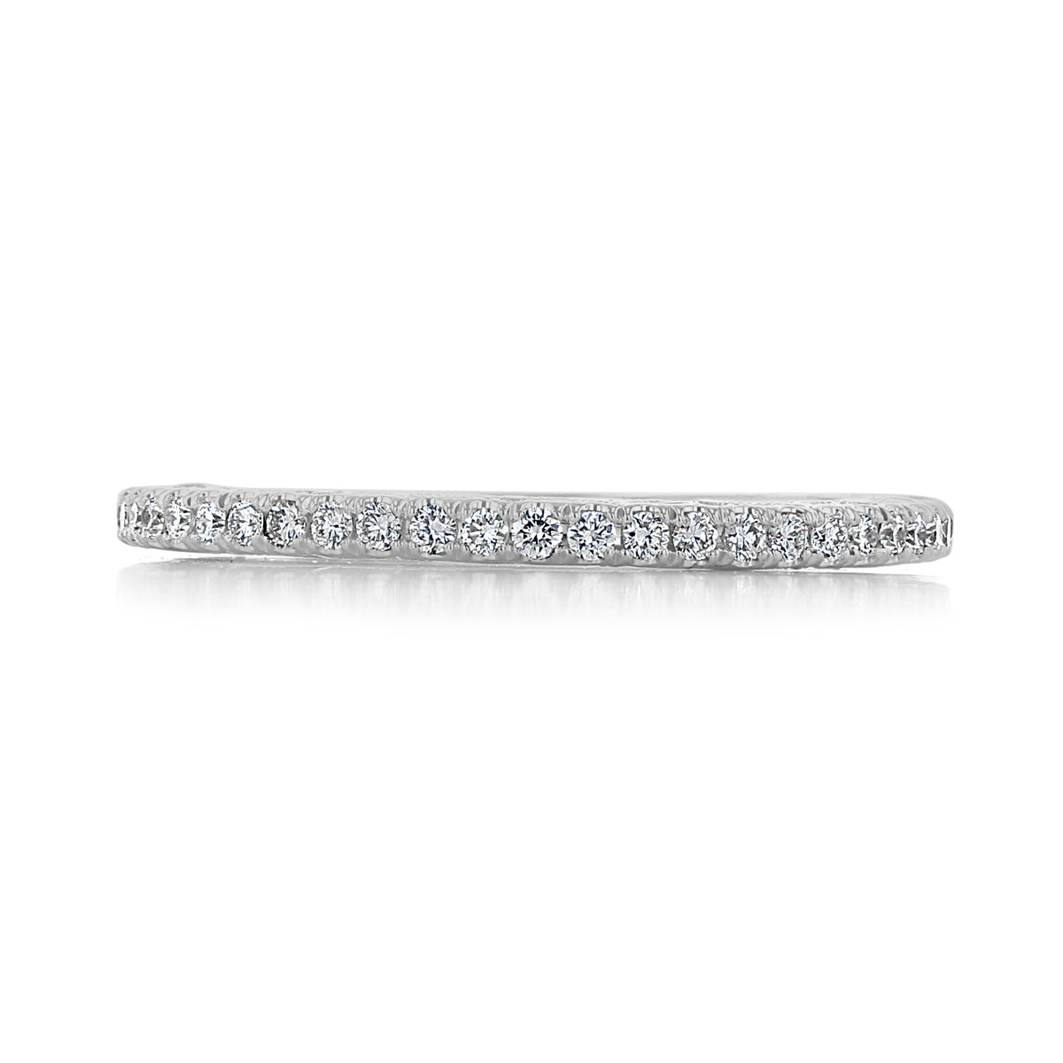 The Dantela | Diamond Wedding Band - 269017B34W is a thin 18k white gold wedding band featuring a row of small, round-cut pavé diamonds in a delicate micro-prong setting.