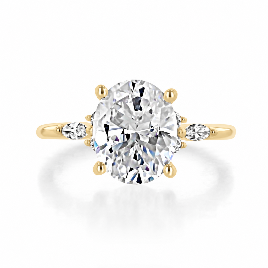 Poppy | Oval Floral Diamond Engagement Ring in 14k yellow gold, top view of an oval center diamond with a trio of side diamonds on each side.