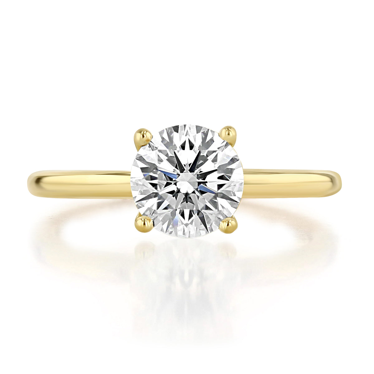 Roxbury | Round Solitaire Engagement Ring featuring a round-cut solitaire diamond set on a high-polished yellow gold band.
