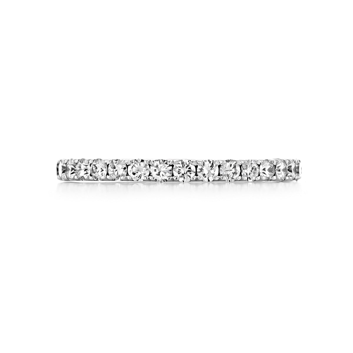 A horizontal Sculpted Crescent | Diamond Band - 33-2 platinum wedding band featuring a continuous row of round prong-set diamonds in polished metal.