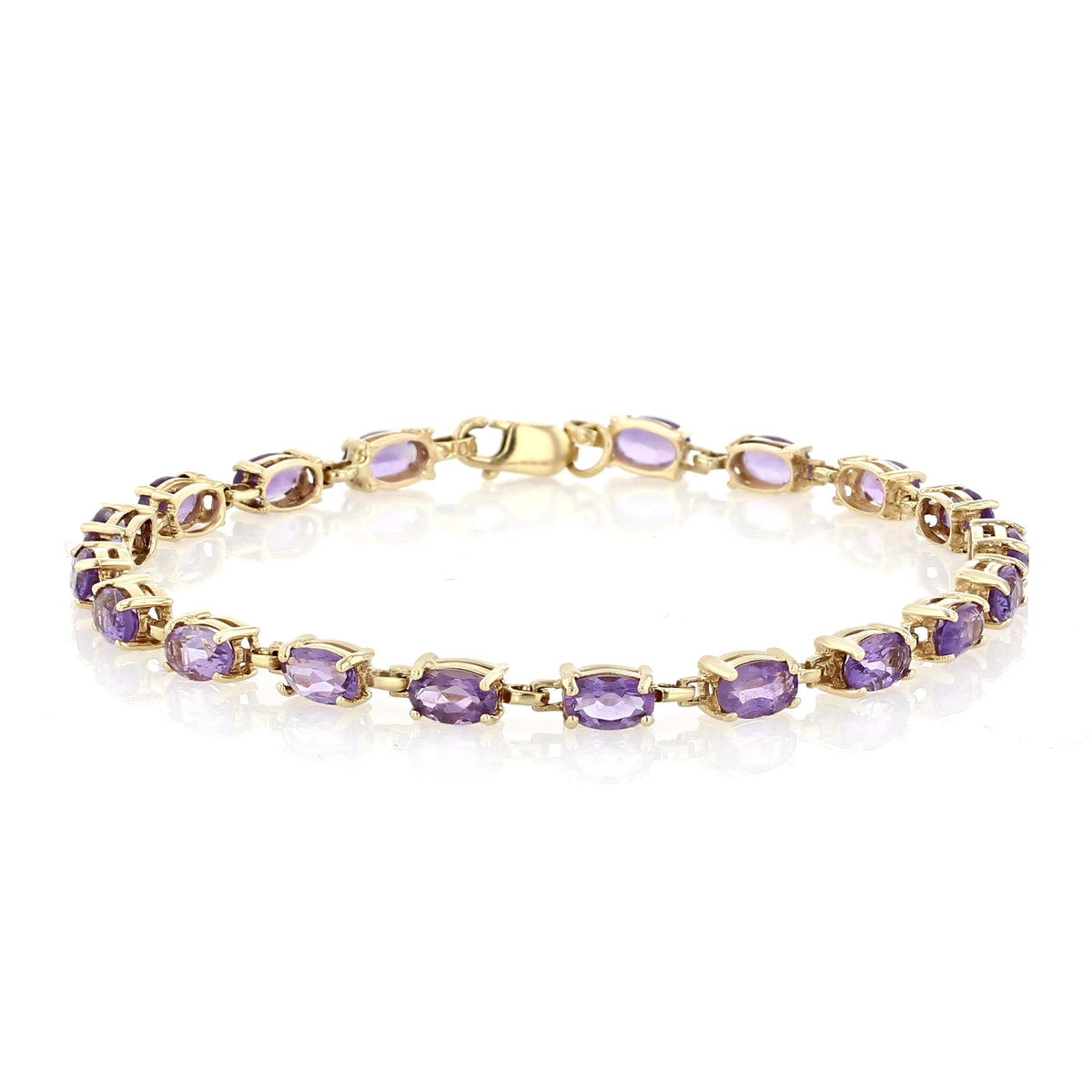 A 14K Yellow Gold Oval Amethyst Bracelet | 7001265 featuring a series of oval-cut amethyst gemstones linked together in 14k yellow gold.