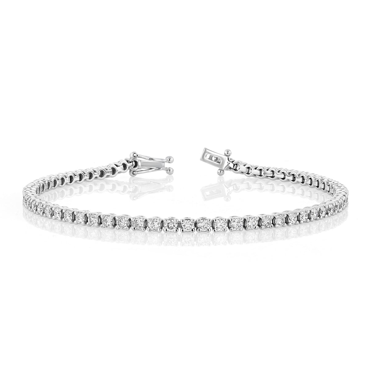A 2.64 ctw Lab Diamond Tennis Bracelet | 7001270 by Icing On The Ring, featuring a continuous row of round, lab-cultivated diamonds set in 14k white gold, shown with its clasp open.
