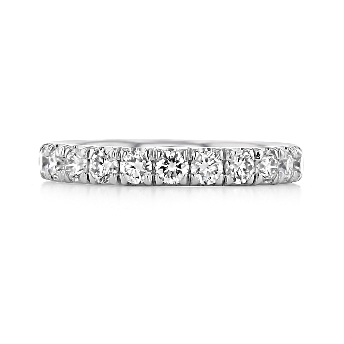 The Ramona Micro-Prong Diamond Wedding Band by Gabriel NY is a platinum ring featuring a single row of round-cut diamonds in a micro-prong setting for timeless sparkle.