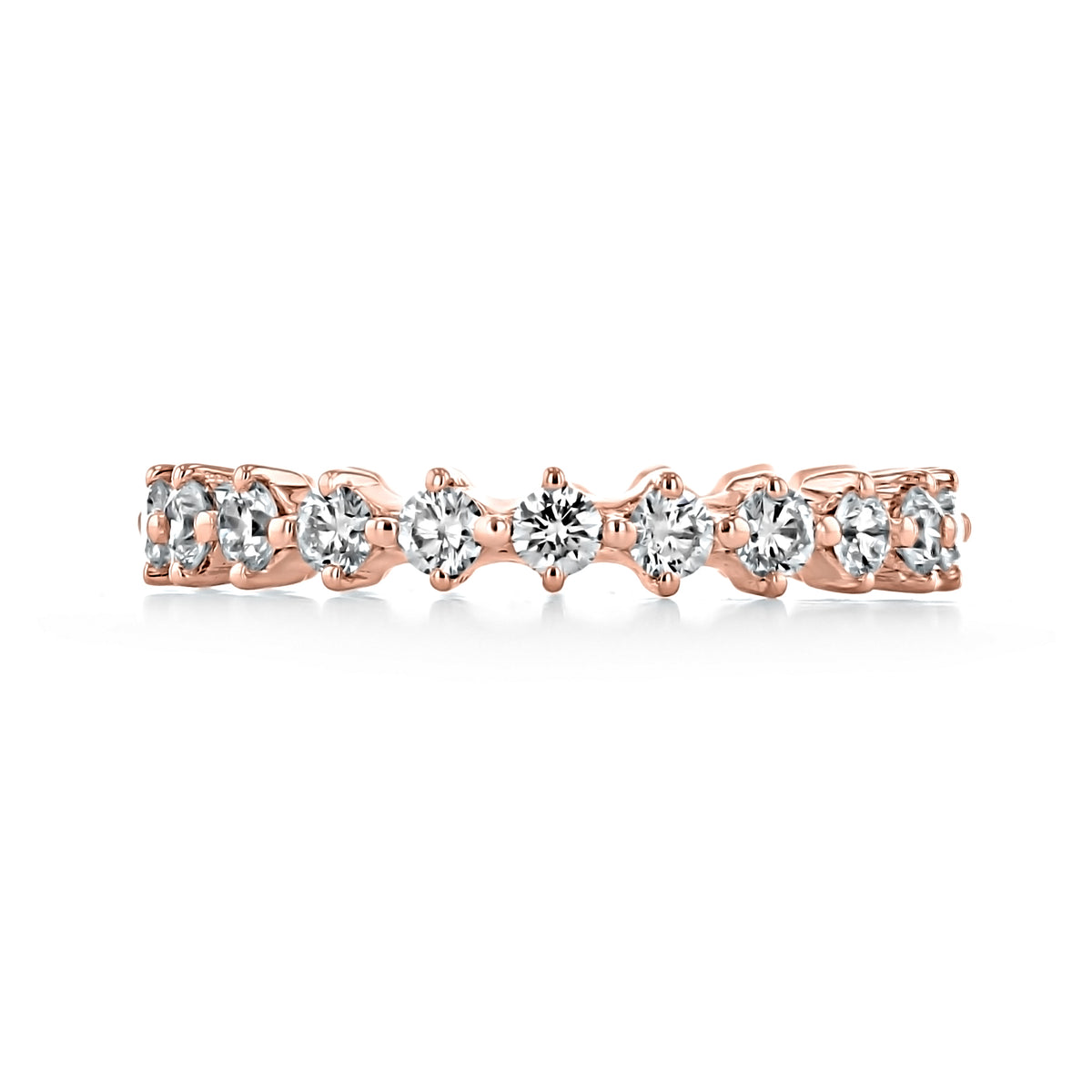 Eden | Compass Prong-Set Diamond Wedding Band in rose gold, featuring a row of round-cut diamonds held by four-prong settings.