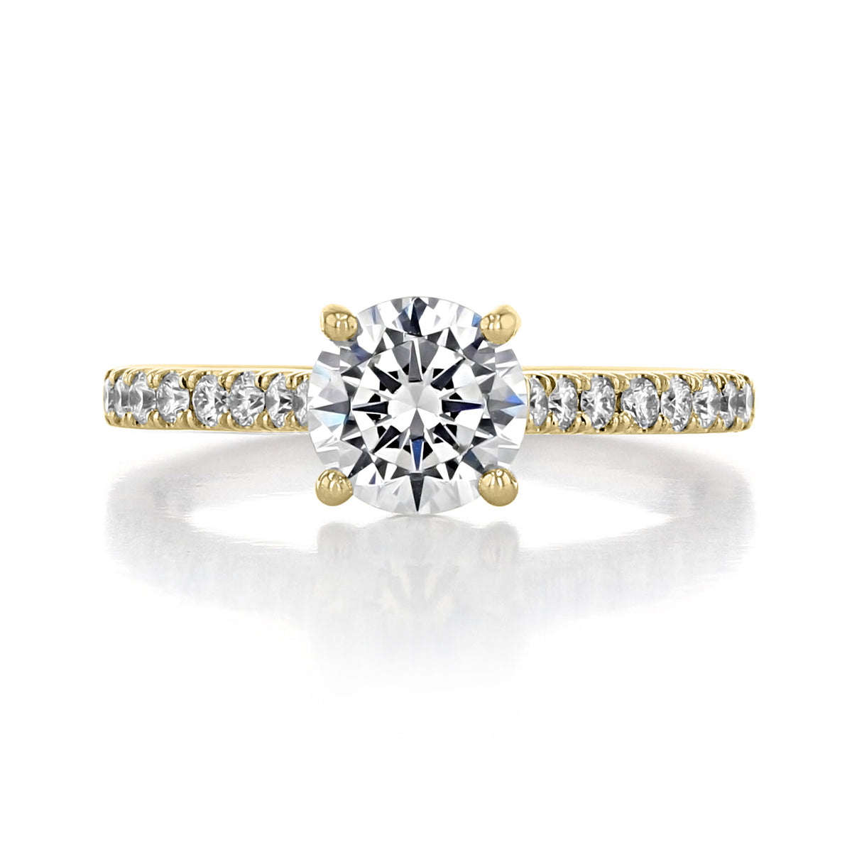 Geneva | Round Micro-Prong Engagement Ring in gold with a round diamond center stone and a French-pave-inspired, diamond-encrusted band.